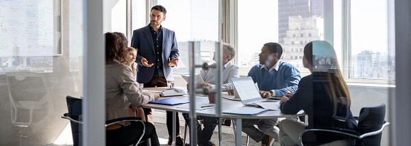 Employees in a conference room having a conversation