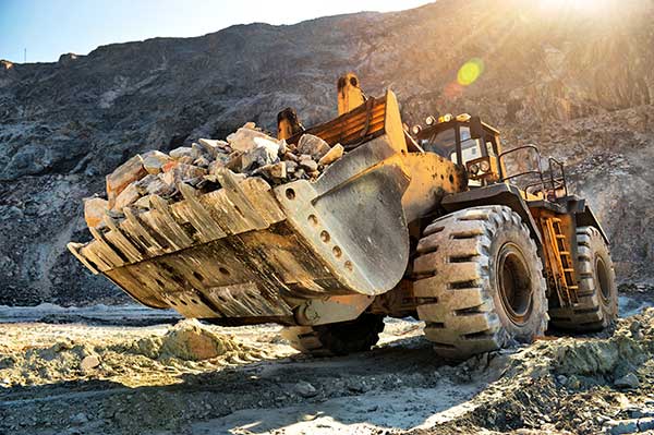 Photo of construction equipment transporting aggregate material.
