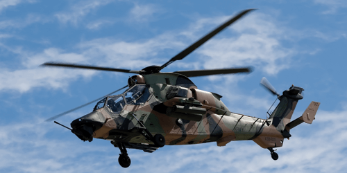 Military Helicopter Hovering with Cloud background