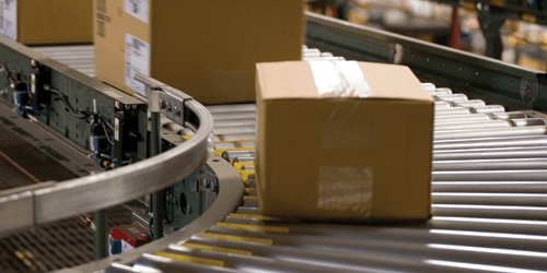 Material Handling Boxes on Roller Conveyor