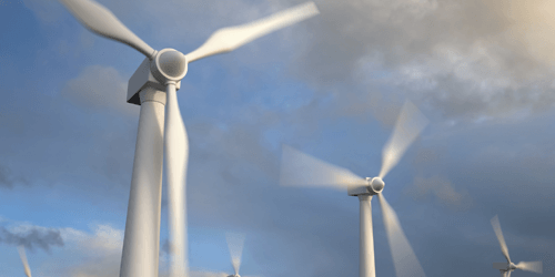 Wind Turbines spinning with cloudes behind
