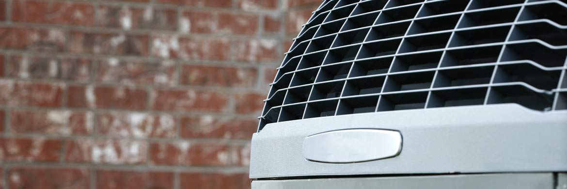Photo of top of outdoor air conditioner unit.