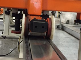 Cam follower supporting cart on linear track