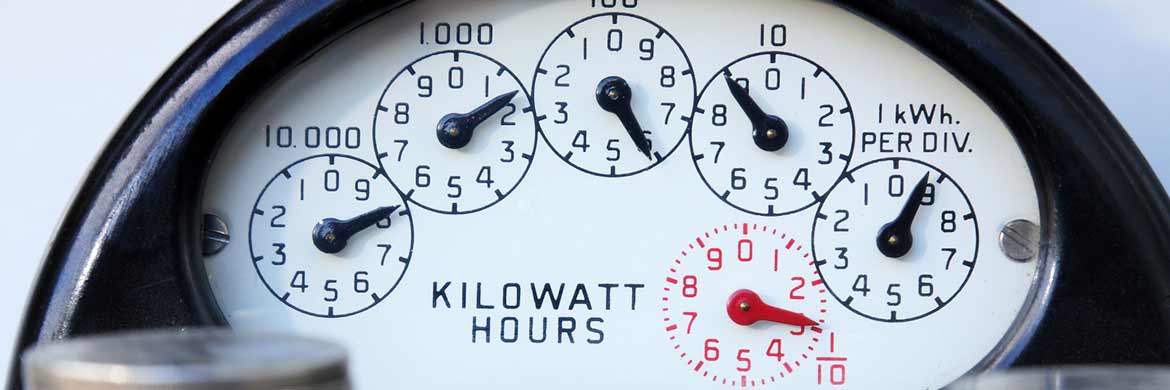 Photo of electric meter showing dials at different points measuring kilowatt hours.