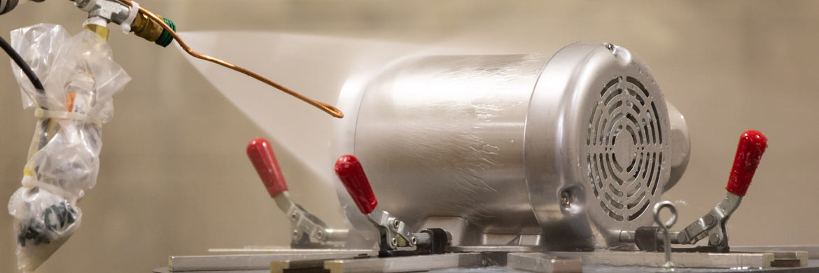 Photo of stainless steel motor undergoing washdown testing.