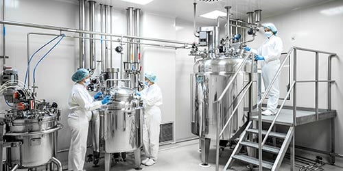 Workers and equipment in a washdown environment.