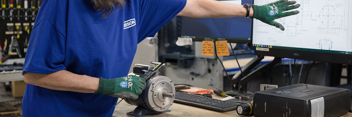 LEESON technician taking measurements on an electric motor.