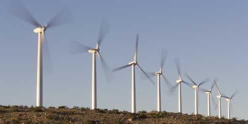 Wind turbines moving on energy farm.