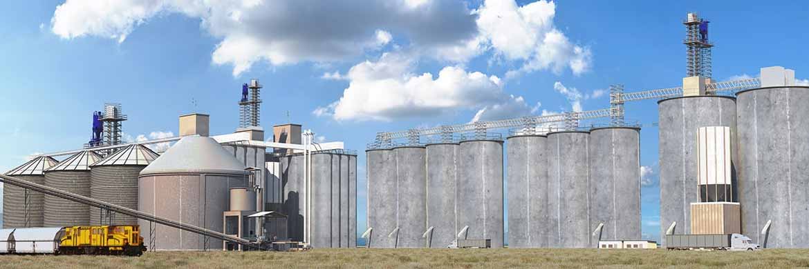 Grain handling facility with multiple silos, trucks and a train. 