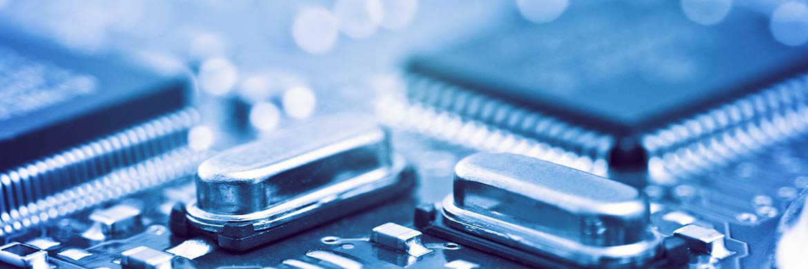Close up of semiconductor components with a blue hue.
